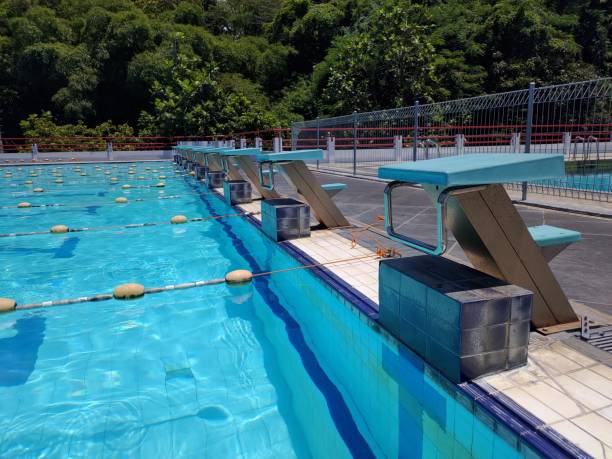istock Swimming pool starting place, blue transparent water 1987245820