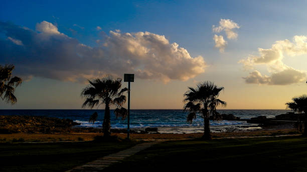 Wooden path heading to a lifeguard hut on the beach of Finikoudes in Larnaca.