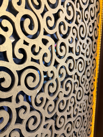 Stock photo showing close-up view of jali room screen architectural decoration. These screen were designed for privacy and security whilst allowing light to enter a room as well as the free movement of air for ventilation.