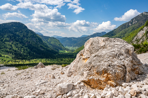 Zgornje Jezersko valley in Slovenia during a beautiful springtime day with the mountain range in the Kamnik–Savinja Alps.