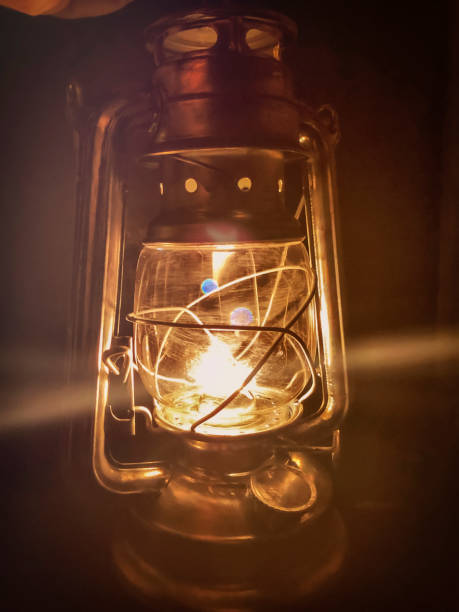 istock Retro kerosene lamp on a dark background. Selective focus. 1987285947