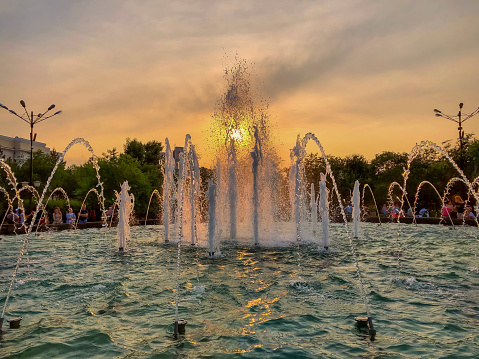 Fountains in the park at sunset,