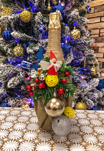 Christmas tree decorated with toys and gift box on the background of the Christmas tree
