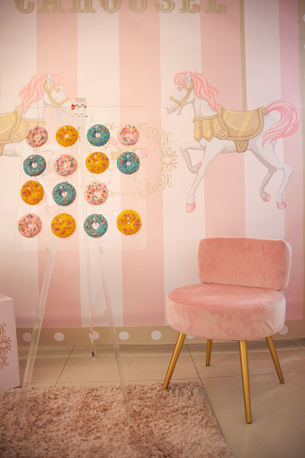 Studio shoot with kids, chair and unicorn themed decoration