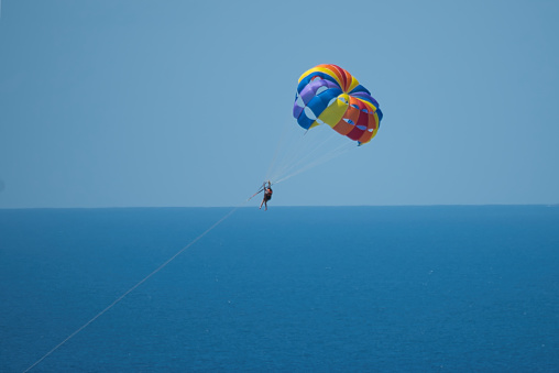 Single person parachuting at beau vallon beach, Mahe, Seychelles