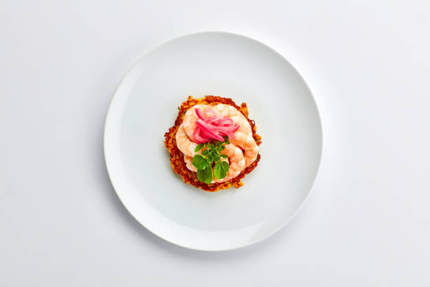istock Fine dining, plate and dinner with fish in restaurant, luxury menu and healthy Asian cuisine. Above, dish and gourmet Japanese seafood recipe with prawn on table for nutrition and protein in diet 1987295301
