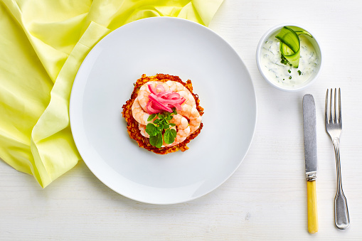 fried prawns on white plate and on white table cloth