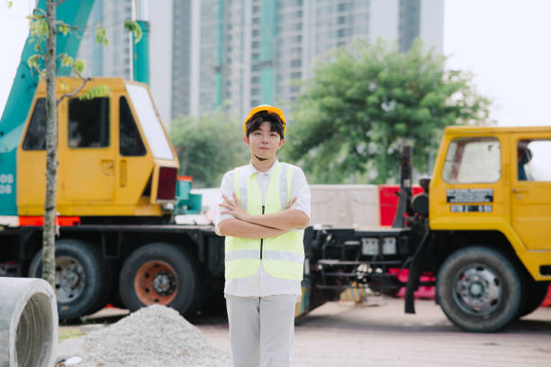 Asian Industrial worker with crane.