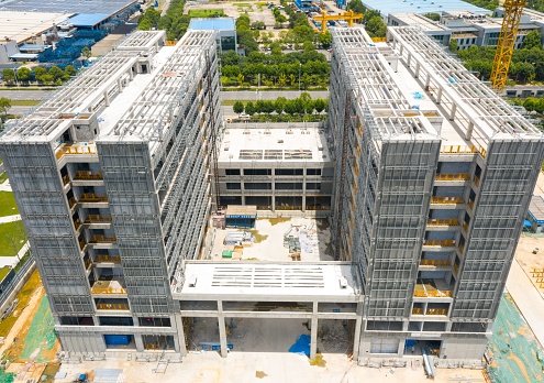 A high-rise university teaching building under construction, with some engineering facilities in operation. Wuhan, China.