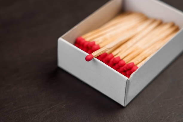Burnt matches blackened tips from ignition closeup.