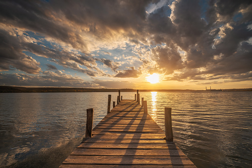 Small Dock at the lake water at sunset landscape, seascape sunrise