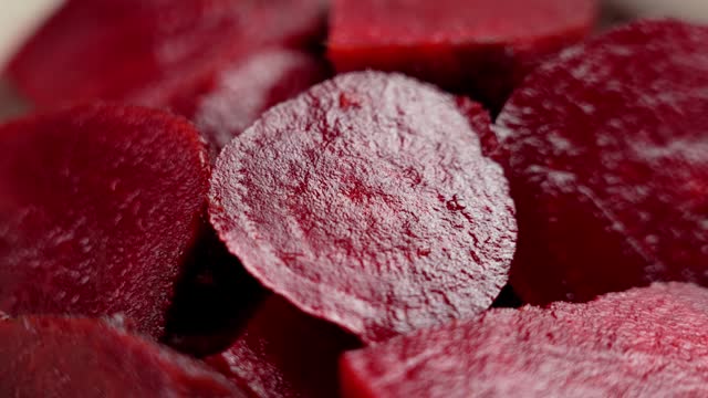 Sliced boiled red beets. Vegetarian and vegan foods. Rotation