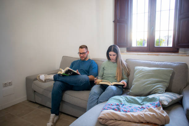 istock Couple on the sofa at home 1987325088