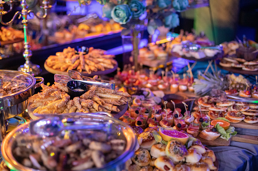 Food bar with different types of appetizers at an elegant party