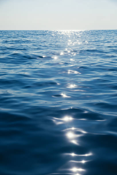 istock Tranquil sea with glistening sun reflection natural background 1987352036