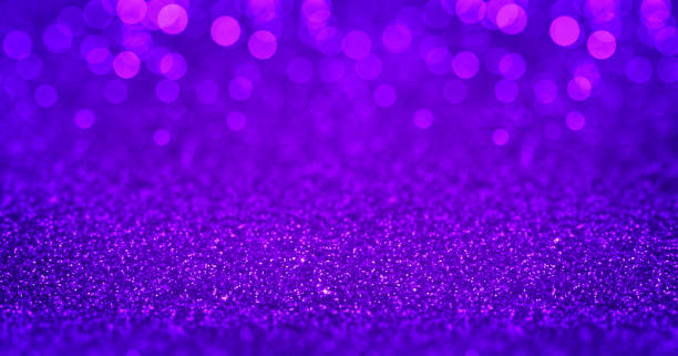 istock Sparkling purple glitter background with magenta bokeh. Closeup view, dof. Pattern with shining fine purple sequins. Festive luxury magenta background, backdrop, texture. Design element 1987389164