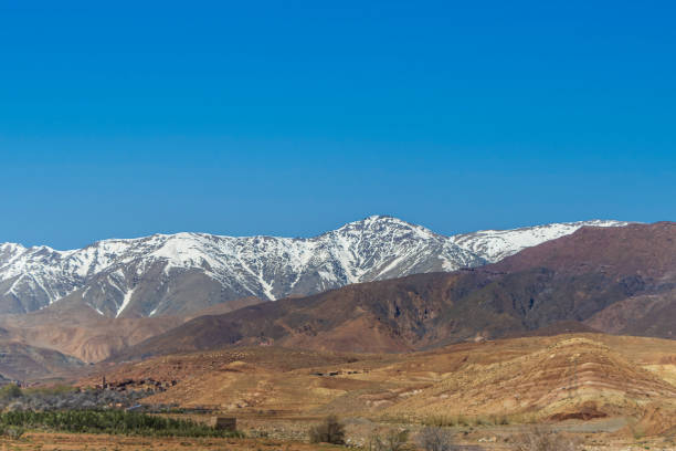 istock Snow covered Atlas Mountains and pine forest between Marrakesh and Ouarzazate. 1987397063