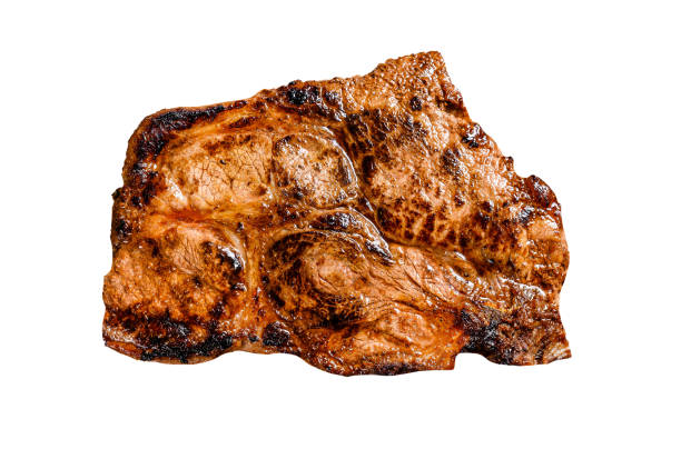 Pork cutlet steak on the bone with spices and herbs.  Isolated on white background. Top view