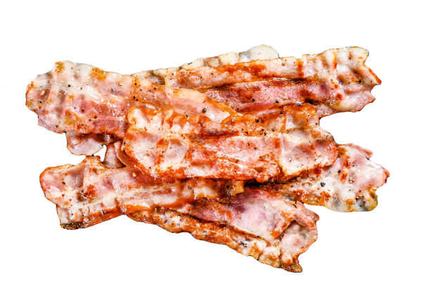 istock Cooked sizzling hot tasty crispy bacon.  Isolated on white background. Top view. 1987420085