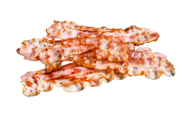 istock Cooked sizzling hot tasty crispy bacon.  Isolated on white background. Top view. 1987420296