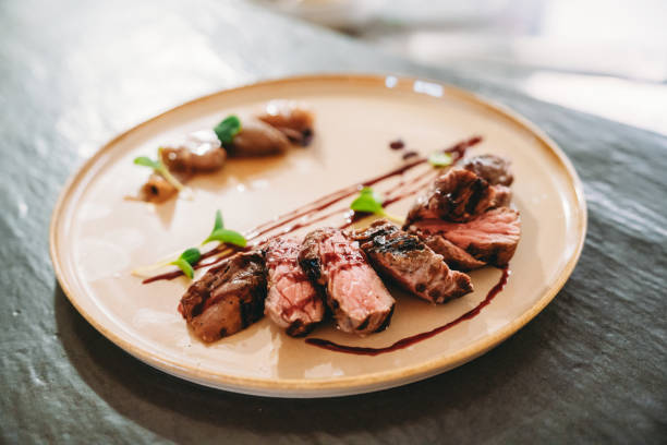 Delicious sliced steak on a plate in a restaurant.