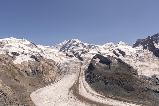 Monte Rosa range seen from the Gornergrat station at 3135 meter above sea level in the European Alps between Switzerland and Italy. Central Monte Rosa massif  with Dufourspitze to the south (right) and Nordend to the north (left), the Monte Rosa Glacier right below on its western wing, the upper Gorner Glacier on the left, and the Grenzgletscher to the right.