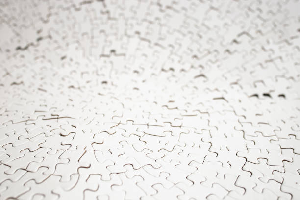 istock Plain white radial jigsaw puzzle defocused, abstract texture close up backdrop 1987460558