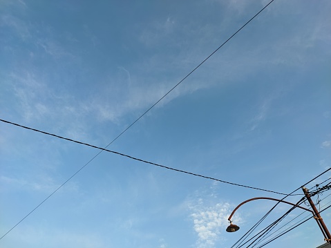 Electricity pylon on a blue sky.