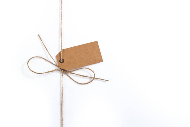 Empty copy space blank present label. Shiny golden ornament ribbon.
