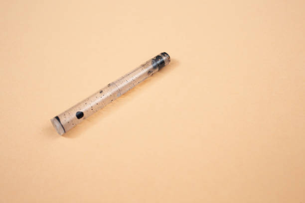 istock empty fountain pen cartridge , on beige background 1987467570
