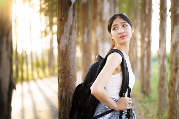 istock Cute Asian young woman relaxing in nature. 1987489623