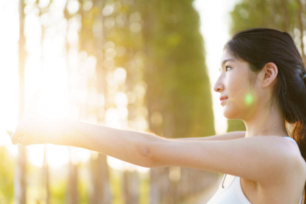 istock Cute Asian young woman relaxing in nature. 1987489639