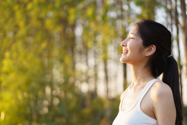 istock Cute Asian young woman relaxing in nature. 1987489640