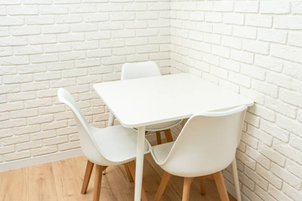 istock White brick wall with table in corner of kitchen 1987521545