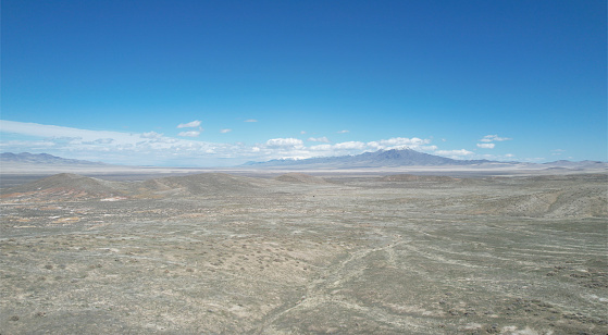 A scenic desert with hills against the background of a blue sky. Nevada, USA