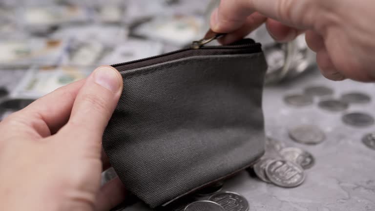 Woman Putting Some Coins into a Small Textile Change Grey Purse. Close-up. 4K