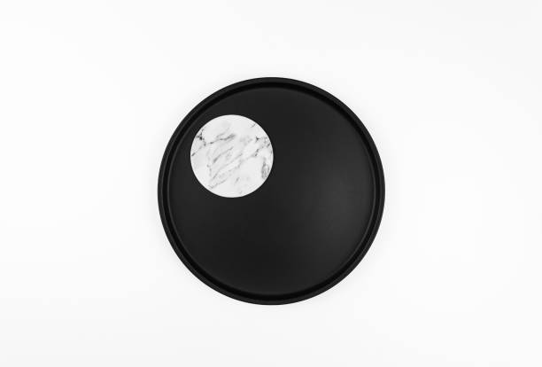 istock Top view of black plate on white background. 1987568837