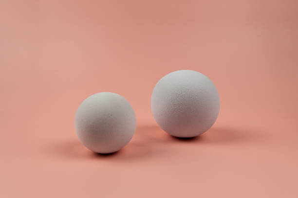 istock 3D white balls on pink background. Two balls composition. 1987568863