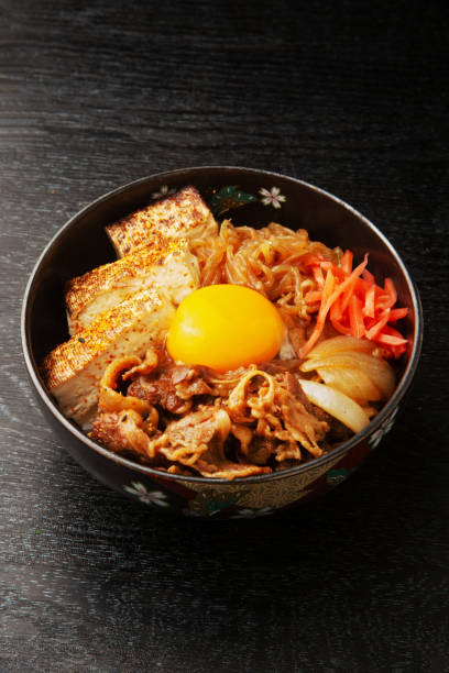 istock Sukiyaki bowl with sukiyaki on rice 1987588384
