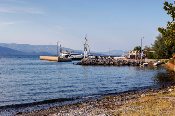 istock Deserted, sandy beach and pier on an autumn day 1987592033
