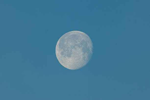 istock Full moon is illuminated by the rising sun 1987608126