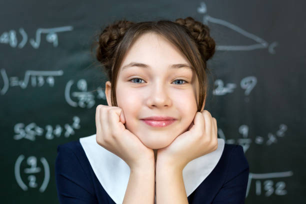 teenage girl near the school board, portrait of a student 12-14 years old - 13 14 years teenager school education imagens e fotografias de stock