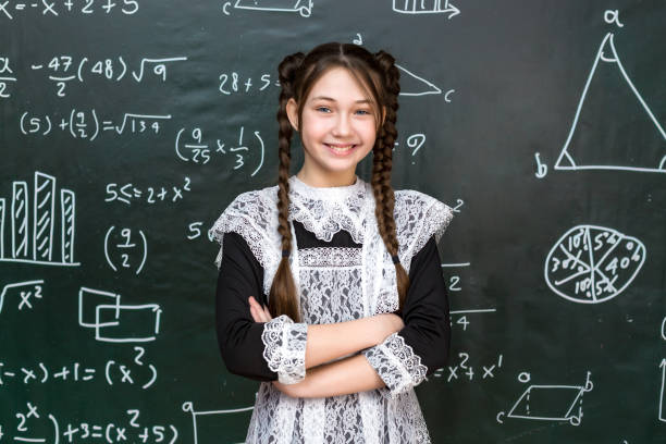 teenage girl near the school board, portrait of a student 12-14 years old - 13 14 years teenager school education imagens e fotografias de stock