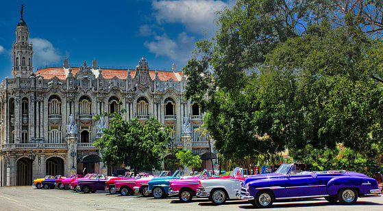 The typical antique Cuban Taxies parked at Parque Central in front of the Gran Teatro de La Habana, Havana, Cuba