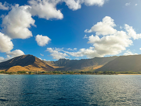 Astonishing blue landscape of Hawaii where the Pacific Ocean meets the sky. Volcanos all around. Great travel destination and wonderful place to observe nature, climate and ecology.