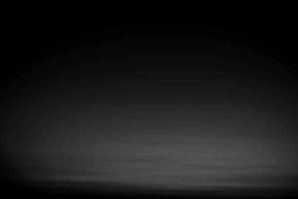 istock Dark black and gray blurred gradient background has a little abstract light. 1987715211