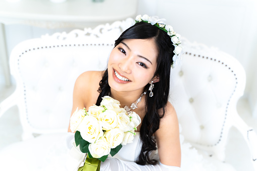 Unrecognizable woman holding a bridal bouquet