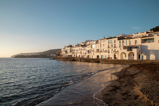 A cluster of seaside homes nestled along the shore. Cadaques, Spain