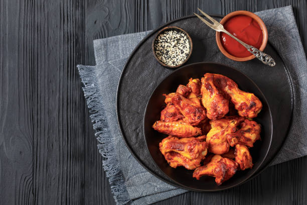 istock spicy crispy grilled chicken wings, top view 1987744394