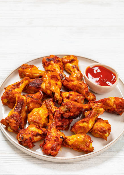 istock spicy crispy grilled chicken wings, top view 1987744395